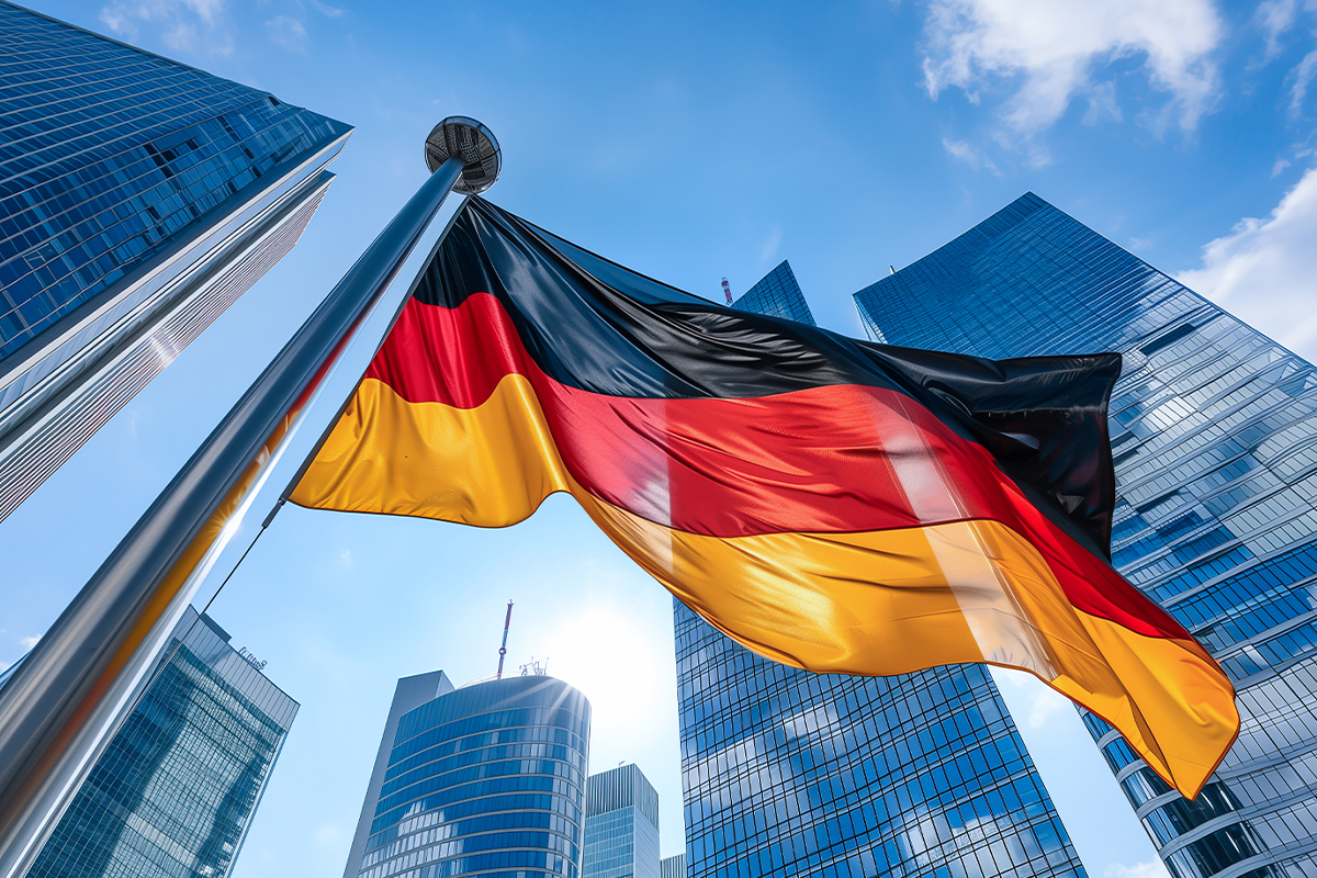 Flaga Niemiec na tle wieżowców